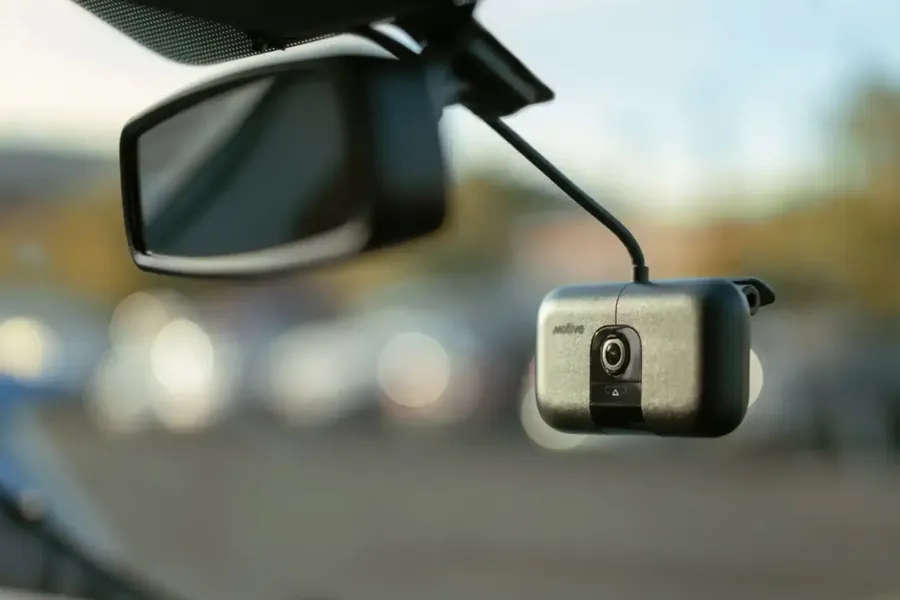 Dash camera mounted behind the mirror